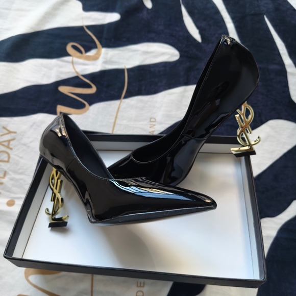 Saint Laurent Shoes - Saint Laurent Black Patent Pointed-Toe Heels with Gold YSL Logo Heel